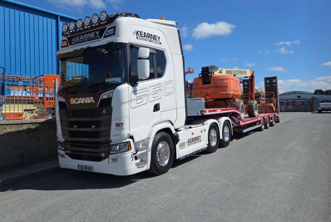 Sean Kearney Transport loading construction equipment with boom lifts